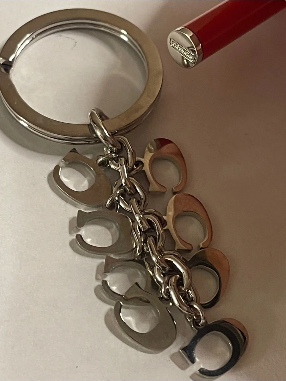 Coach Silver-Tone Keyring with Orange Enamel 'C' Charms